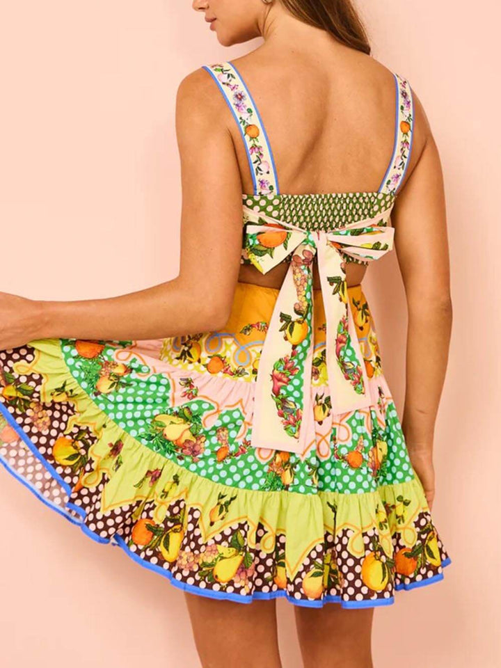 Korte jurk met fruitprint en speelse stroken
