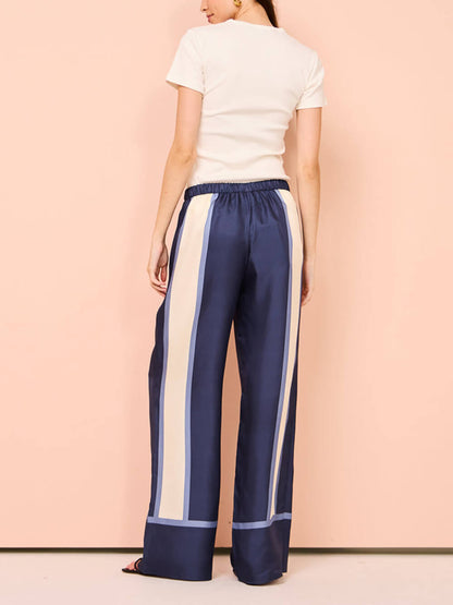 Broek met contrasterende biezen