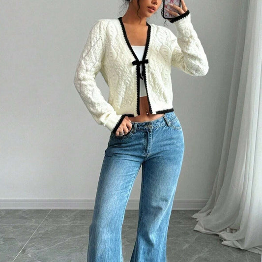 Chique vest met zwarte bies