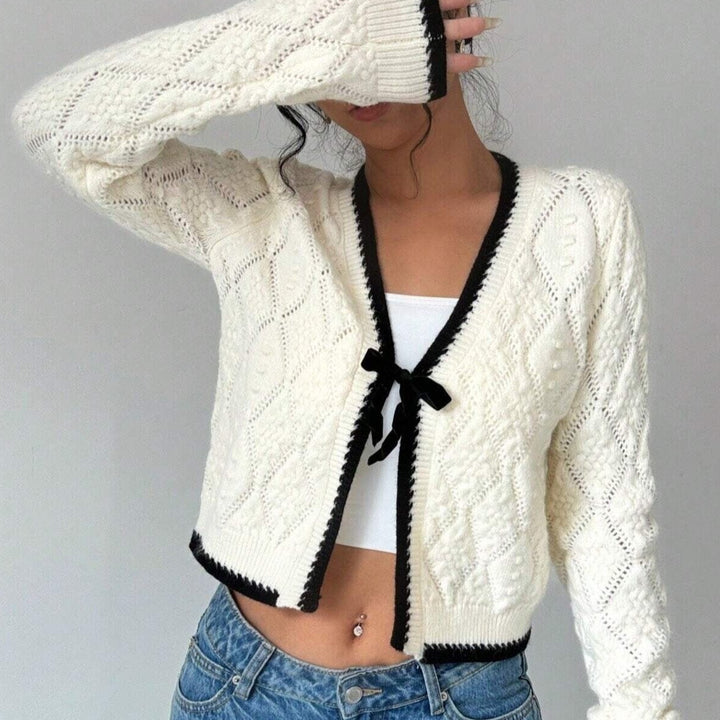 Chique vest met zwarte bies