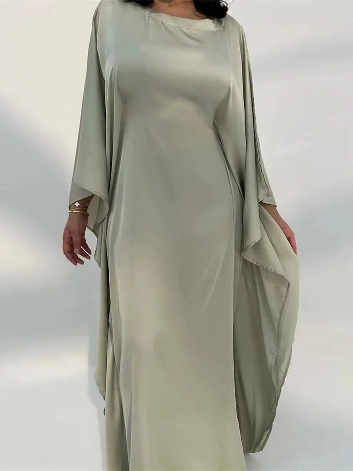 Elegante maxi-jurk met spaghettibandjes en hoge split