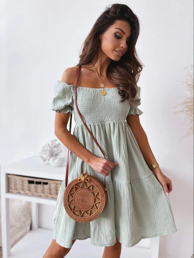 Elegante mini-jurk met één schouder voor de zomer