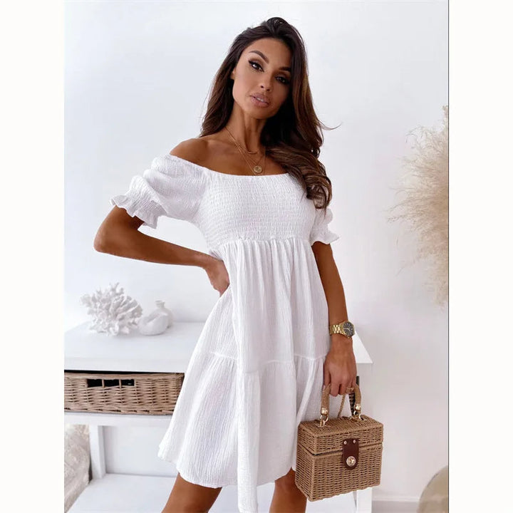 Elegante mini-jurk met één schouder voor de zomer