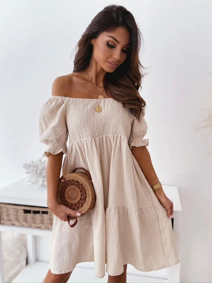 Elegante mini-jurk met één schouder voor de zomer