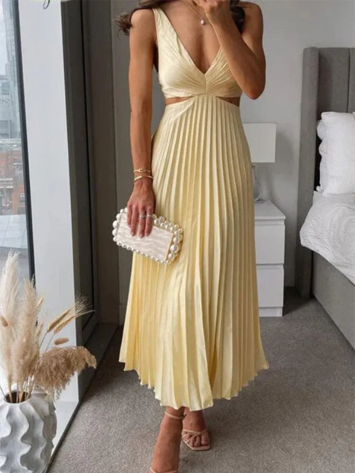 Elegante mouwloze jurk met open rug. Sierlijke verfijning voor gelegenheden bij warm weer.