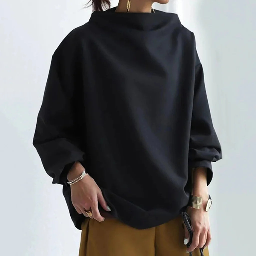 Minimalistische losvallende top Tijdloze eenvoud met alledaags comfort
