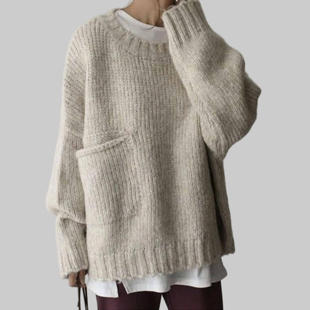 Oversized ivoorkleurige trui met zak aan de voorkant – een relaxte laag voor elke dag